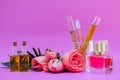 Essential oil in bottles extracted from rose leading to products that have an important ingredient is rose extract