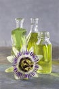 Essential oil bottles with a passion flower Royalty Free Stock Photo