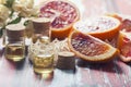 Essential oil citrus with orange slices, in glass bottle on ol Royalty Free Stock Photo