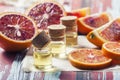 Essential oil citrus with orange slices, in glass bottle on ol Royalty Free Stock Photo