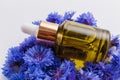 Essential oil of cornflower on a white background Royalty Free Stock Photo