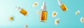 Essential oil dropper bottles floating with chamomile flowers on light blue background Royalty Free Stock Photo