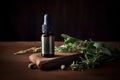 Essential oil in a glass bottle with fresh herbs on a wooden table