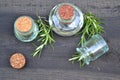 Essential oil made from rosemary on rustic black wooden  table flat lay with copy space Royalty Free Stock Photo