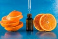 Essential oil with orange slices, bottle and dropper Royalty Free Stock Photo