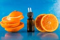 Essential oil with orange slices, bottle and dropper Royalty Free Stock Photo