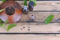 Essential oil from peppermint in bottle and mint with pepper in bowl