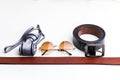 Essentials modern man glasses, tie and belt Royalty Free Stock Photo