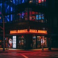 Essex Market neon sign at night, in the Lower East Side, Manhattan, New York City