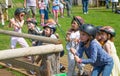 Kids practicing with the catapult in the Norman village. Reconstruction of medieval period 1050, educational centre for kids with