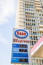 Esso Express petrol fuel station with large appartment building