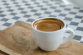Esspresso coffee in a white cup on the table. Royalty Free Stock Photo