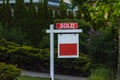 Estate agency SOLD signage. Real estate market property sold sign in front of new house. Copy space for Text. Royalty Free Stock Photo