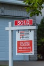 Estate agency SOLD signage with Agency Name Royal LePage. Real estate market property sold sign in front of new house.