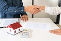 Estate agent giving house keys customer sign agreement property for sale, Buying and selling homes concept Royalty Free Stock Photo