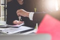 Estate agent giving house keys to customer and sign agreement in Royalty Free Stock Photo