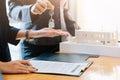 Estate agent giving house keys to man and sign agreement in office Royalty Free Stock Photo