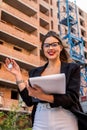 estate agent holding clipboard near new house Royalty Free Stock Photo