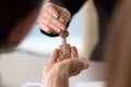 Estate agent making deal with family, giving keys to apartment Royalty Free Stock Photo