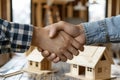 Estate agent shaking hands with buyer after signing the house contract. Generative ai Royalty Free Stock Photo