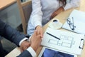 Estate agent shaking hands with his customer after contract signature. Royalty Free Stock Photo