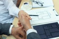 Estate agent shaking hands with his customer after contract signature. Royalty Free Stock Photo