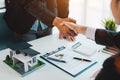 Estate agent shaking hands with his customer after contract signature Royalty Free Stock Photo