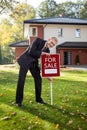 Estate agent trying to sell house Royalty Free Stock Photo