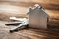 Estate concept, Key ring and keys on wooden background Royalty Free Stock Photo