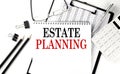 ESTATE PLANNING word on notepad with clipboard , chart and calculator, business concept Royalty Free Stock Photo