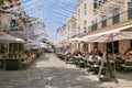 Restaurant tables on street in seaside Alcudia old town, Mallorca Royalty Free Stock Photo