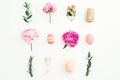 Ester festive composition with eggs, pink peonies, hypericum and eucalyptus branches on white background. Flat lay