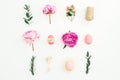 Ester holiday composition with eggs, pink peonies and eucalyptus branches on white background. Flat lay