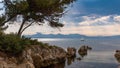 The Esterel mountain range and a sailboat seen from the Lerins Island off the coast of Cannes Royalty Free Stock Photo