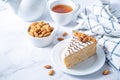 Esterhazy cake decorated with almonds in a plate