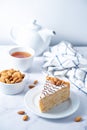 Esterhazy cake decorated with almonds in a plate