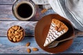 Esterhazy cake decorated with almonds in a plate