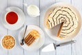 Esterhazy torte on plate and cup of tea