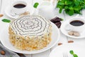 Esterhazy traditional cake with almonds and pralines on a white wooden background on a plate with a cup of coffee. Royalty Free Stock Photo
