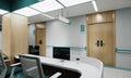 Esthetic and clean modern hospital reception and corridor, private clinic or vet waiting room with empty posters and walls. Royalty Free Stock Photo