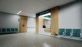 Esthetic and clean modern hospital reception and corridor, private clinic or vet waiting room with empty posters and walls. Royalty Free Stock Photo