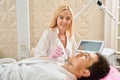 Esthetician doctor performs microneedle RF lifting procedure for neck area