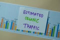 Estimated Organic Traffic write on sticky notes isolated on office desk