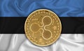 Estonia flag, ripple gold coin on flag background. The concept of blockchain, bitcoin, currency decentralization in the country.