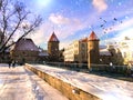 Estonia,Tallinn.Winter in old town city park ,medieval tower roof,tourist walking,Travel to Estonia Europe