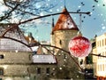 Estonia .Tallinn .winter in old town red Christmas ball on tree in city park .snowflakes, travel to Europe Estonia romantic back