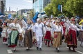 Estonian people in traditional clothing walking the streets of Tallinn