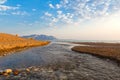 Estuary of a small river on a sandy beach, Greece. Royalty Free Stock Photo