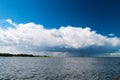 Estuary of the Vistula River to the Baltic Sea with the Cumulus mediocris cloud in the sky. Royalty Free Stock Photo