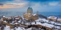 Esztergom, Hungary - Aerial panoramic view of the beautiful snowy Basilica of Esztergom with Slovakia at the background